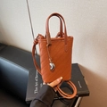 Brown woven leather mini bucket bag with silver metal pendant and shoulder strap - Brown