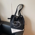 Black casual canvas tote bag with drawstring closure and white circular text print - Black