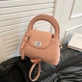 Pink vintage bucket bag with vertical pleats and golden metal lock and shoulder strap - Pink
