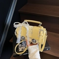 Fashionable pale yellow woven crossbody bag featuring lace and pearl bow decorations - With Charm / Yellow