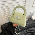 Mint green crossbody bucket bag with pleated texture and stylish round top handle - Green