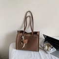 Brown lychee leather tote bag with white stitching and bear charm for office work - Brown