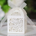 Detailed laser-cut rose patterns on white wedding favor box with a silk ribbon bow - Ivory