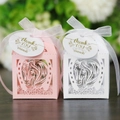 Detail showing pink and white laser-cut favor boxes with horse motifs and silk ribbons - Style 1 (With Tags)