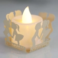 Dettaglio del copricandela in carta tagliata a laser con silhouette di ragazza e luce LED - Stella Crema Gioiello