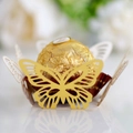 Macro shot of yellow laser-cut butterfly cupcake liner for elegant wedding table decor - Reflective Gold