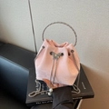 Pink suede bucket bag featuring silver ring handle and butterfly clasp with pearl detail - Pink