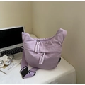Detail of purple canvas crossbody bag with double zippers and stylish woven pullers - Lilac Small
