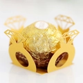 Macro shot of gold diamond ring shaped hollow paper chocolate wrapper for wedding decor - Gold