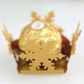 Close-up of laser-cut white snowflake decorative favor box with golden chocolate holder - Gold
