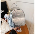 Detail of silver mini backpack with floral print, metal logo, and white plush charm - Silver (With Pendant)