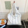 Minimalist canvas tote bag with blue and white vertical stripes for women's daily commute - Blue Striped