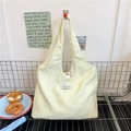 Minimalist light yellow floral canvas tote bag with Korean style woven label detail - Yellow