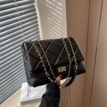 Classic black quilted shoulder bag with gold chain strap and metallic twist-lock closure - Black