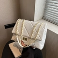 Modern white quilted crossbody bag with gold chain strap and elegant metallic rotating lock - White