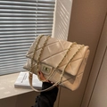 Chic quilted beige shoulder bag with golden chain strap and stylish turn-lock closure - Beige