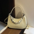 Creamy yellow faux leather dumpling bag with decorative pearl and heart chain strap - Yellow