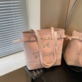 Pink glossy PU leather tote bag with a silver bow decoration and adjustable straps - Pink