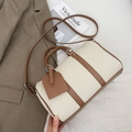 Chic cream and brown bowling bag with top handles and adjustable strap for women - White