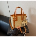 Detail view of mini bucket bag in vintage monogram canvas with tan leather trim and handles - Light Khaki With Pendant