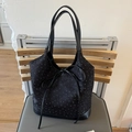 Borsa a secchiello nera glitterata con elegante fiocco e manici in similpelle - Nero