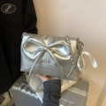 Silver ballet-style crossbody bag featuring a large bow and metallic chain strap - Silver (With Charm)