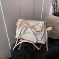 Elegant cream ballet-style crossbody bag with large bow detail and silver chain strap - White (With Pendant)