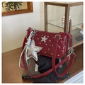 Detail of red quilted patent leather shoulder bag with silver star studs and charms - Red with Pendant