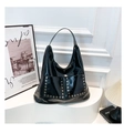 Detail of black patent leather hobo bag with silver hexagonal rivets and sleek glossy finish - One Size / Black