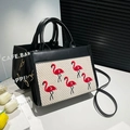 Black leather handbag with beige woven panel and elegant red flamingo embroidery details - Black