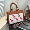 Brown PU tote bag with white woven panel featuring five red flamingo embroidery accents - Brown