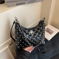 Black quilted hobo bag with rhinestone star detail and silver chain strap - Black
