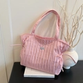 Pink quilted tote bag with drawstring detail and minimalist pleated design for women - Pink