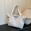 Minimalist white pleated tote bag with drawstring detail and textured nylon fabric - White