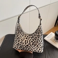 Chic black and white leopard print hobo bag in a glossy finish for daily commute - White