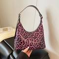 Glossy purple leopard print hobo bag with adjustable black strap and gold buckle - Purple