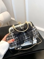 Elegant black and white tweed evening clutch with lace bow and pearl charms detail - Black