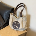 Sac fourre-tout en toile beige avec lanières en cuir marron et écusson logo - Blanc Cassé