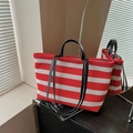 Striped red and white mesh tote bag with black leather handles and long shoulder strap - Red