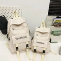 Set di due zaini in tela bianco crema in dimensioni grandi e piccole con fibbia nera - Grande / Bianco