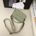 Lightweight sage green square crossbody bag with textured grid fabric and adjustable strap - Green