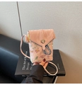 Close-up of pink lace crossbody phone bag with floral embroidery and heart metal buckle - Pink