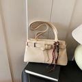 Chic off-white faux leather shoulder bag with buckle strap and woven rope accent - White (With Pendant)