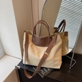 Large beige canvas tote bag with deep brown leather handles and adjustable shoulder strap - Khaki