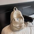 Minimalist beige nylon backpack with functional side pockets and front webbing detail - No Pendant / Off White