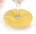 Detail view of yellow paper place cards for wine glass base decoration at party - Gold