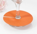 Macro shot of an orange paper wine glass place card with a precision slot on clear glassware - Orange Red