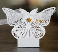 Close-up of white hollow butterfly gift box with floral pattern and silk ribbon - 50 Pieces / White