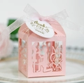 Pink laser-cut wedding favor box with ribbon and Thank You tag featuring Mr Love Mrs silhouette - Pink