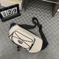 Cream and black utilitarian crossbody chest bag with adjustable bungee cords and reflective trim - Black